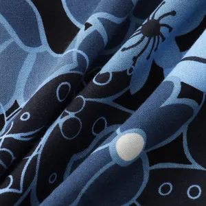 Close-up detail of blue and black floral print fabric for men's summer short sleeve shirt