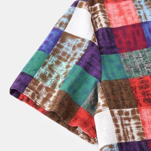 Close-up detail of ethnic style colorful patchwork fabric texture on men's casual shirt