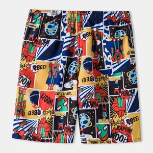 Detail view of breathable men's beach shorts with vibrant comic book style robot print