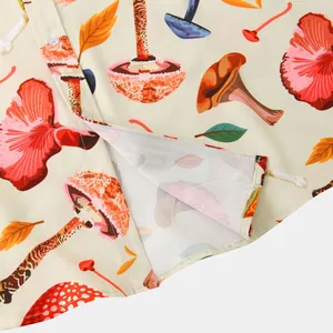 Close-up of mushroom and leaf print on men's casual short-sleeve shirt.