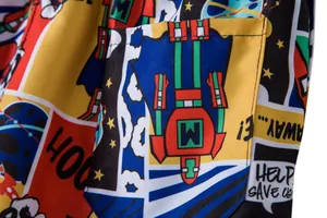 Close-up detail of vibrant retro comic book print on breathable men's beach shorts fabric