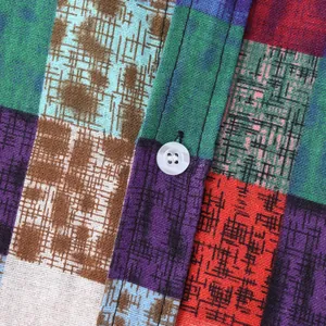 Macro view of ethnic style patchwork fabric on men's casual long sleeve shirt