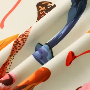 Close-up of lightweight fabric with vibrant abstract and floral prints for men's shirt