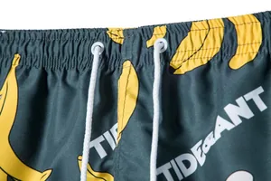 Detail of men's beach shorts showing elastic waistband with white drawstrings