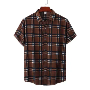 Front view detail of a men's brown checkered short-sleeve shirt on a wooden hanger