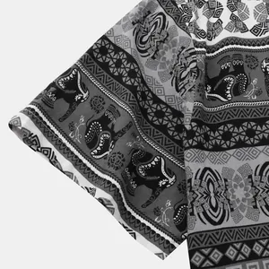 Close-up of ethnic elephant and geometric patterns on a men's shirt