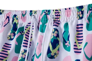 Close-up of men's summer beach shorts featuring a colorful flip-flop pattern waistband