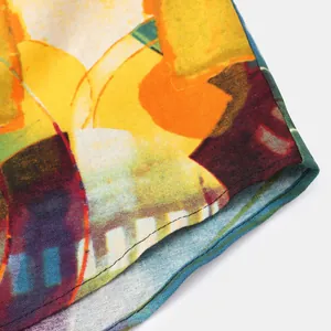 Detailed close-up of ethnic floral shirt hem showing precise stitching and vibrant colors
