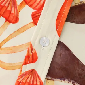 Close-up detail of white button and vibrant mushroom print on men's summer cotton shirt