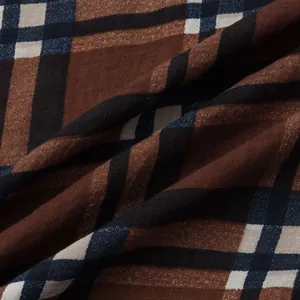 Macro view of high-quality brown and navy plaid fabric texture for men's Hawaiian beach shirt