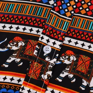 Close-up detail of ethnic pattern fabric on a men's short-sleeve shirt with button.
