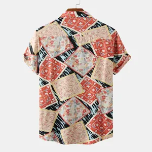 Back view of men's short-sleeve shirt with vibrant vintage floral patchwork print.