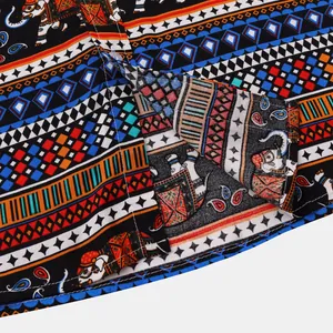 Detailed macro view of ethnic elephant pattern and stitching on a men's shirt