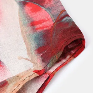 Close-up of ethnic floral print fabric and stitching on a men's casual slim fit shirt.