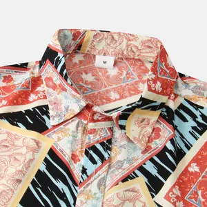 Close-up of men's summer short-sleeved shirt with vibrant floral and geometric print collar.