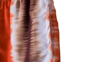 Detailed view of breathable tie-dye fabric and high-quality stitching on men's beach shorts