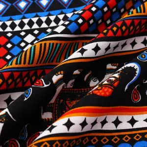 Detailed macro shot of vibrant ethnic pattern fabric with elephant motifs and geometric stripes