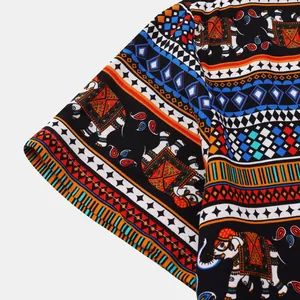 Close-up detail of ethnic elephant and geometric stripe pattern on men's shirt sleeve