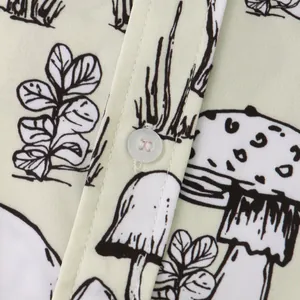 Detailed macro shot of mushroom plant print and button on men's casual short sleeve shirt