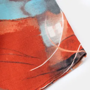 Close-up of ethnic abstract print fabric detail on a men's casual linen shirt cuff