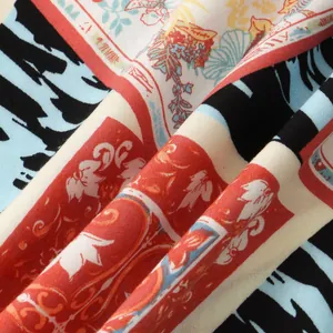 Close-up macro detail of the breathable printed fabric showing tropical floral patterns.