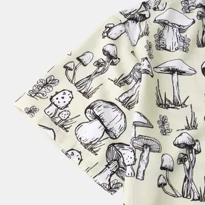 Detail shot of men's casual short sleeve shirt featuring black mushroom line art print
