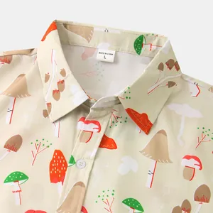 Close-up detail of a men's casual shirt featuring a vibrant mushroom print and collar