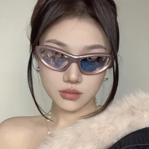 Close-up of stylish Y2K cat eye sunglasses with UV400 protection on model.