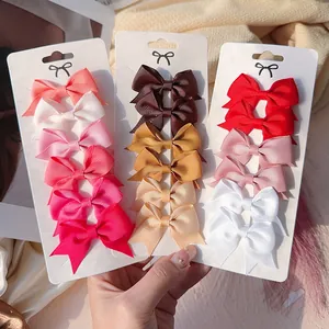 Detail view of a colorful set of grosgrain ribbon bow hair clips for girls and kids
