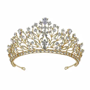 Detailed view of elegant golden bridal tiara with sparkling zirconia and floral design