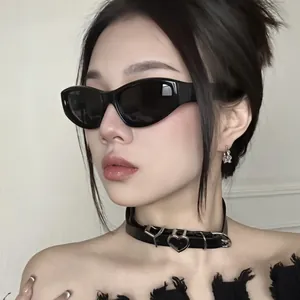 Model wearing stylish black Y2K cat-eye sunglasses with a punk leather choker.