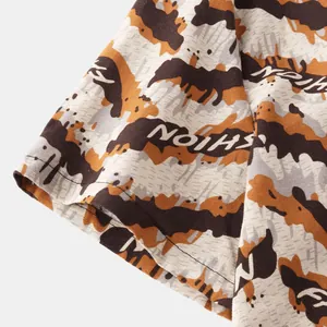 Close-up detail of the ethnic floral pattern and fabric texture on men's casual shirt