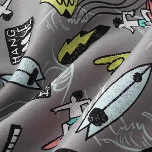 Close-up of breathable fabric with colorful surfing cartoon print for men's beach shorts