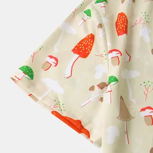 Detailed view of the vibrant mushroom print pattern on a men's casual short-sleeved shirt