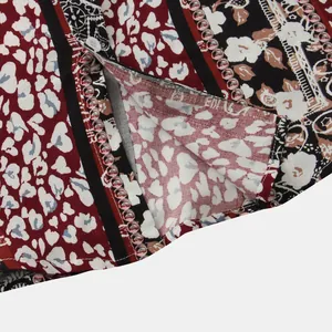 Close-up detail of men's floral print short sleeve shirt showing fabric and stitching