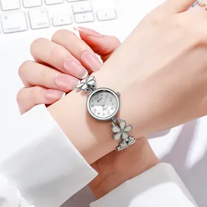 Elegant women's quartz watch featuring a unique white flower bracelet strap design.