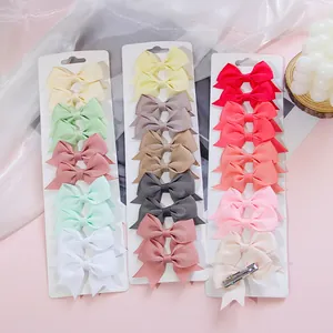 Set of colorful grosgrain ribbon bow hair clips for baby girls in various candy colors