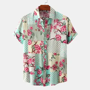 Detailed view of artistic floral patchwork men's short sleeve summer shirt on a wooden hanger