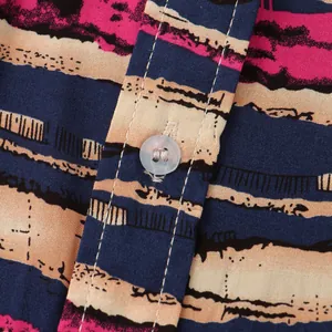 Macro view of abstract striped men's shirt fabric detail with button and stitching