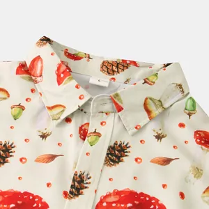 Close-up detail of men's slim-fit shirt collar with mushroom and pinecone print