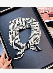 Detail shot of a vintage black and white striped silk cotton square scarf for women.
