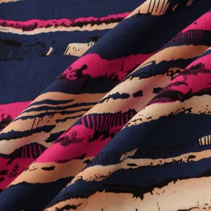 Detailed macro view of pink and navy abstract striped fabric texture for men's shirt.