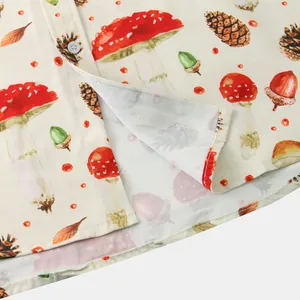 Close-up detail of mushroom and pinecone print on men's casual short sleeve shirt