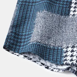 Λεπτομέρεια του μοτίβου houndstooth στο στρίφωμα του βαμβακερού λινού πουκάμισου με μπλε χρώμα