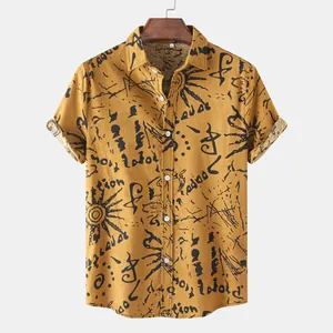 Detail view of mustard yellow men's casual shirt with black ethnic graffiti print