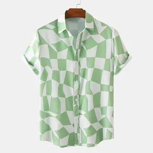 Close-up of men's casual short-sleeve shirt featuring a green and white geometric pattern