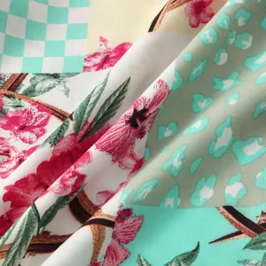 Close-up detail of men's summer shirt fabric featuring mixed floral and leopard patterns