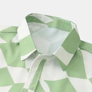 Detailed close-up of men's casual shirt with green geometric triangle print