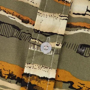 Close-up detail showing the fabric texture and white button on a striped short-sleeve shirt