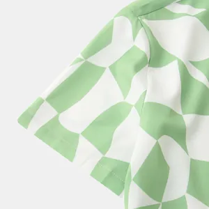 Close-up of green and white geometric pattern on men's casual short sleeve shirt